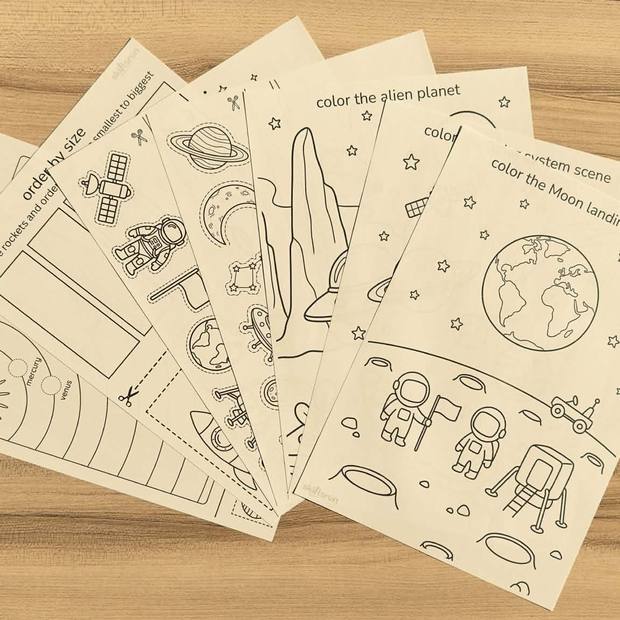 A fan of printed SkillsRen worksheets on a table